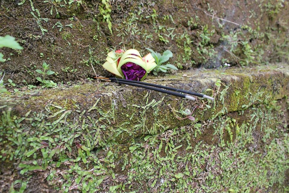 An offering of flowers and insense, placed at this temple by my guide, to appease the spirits